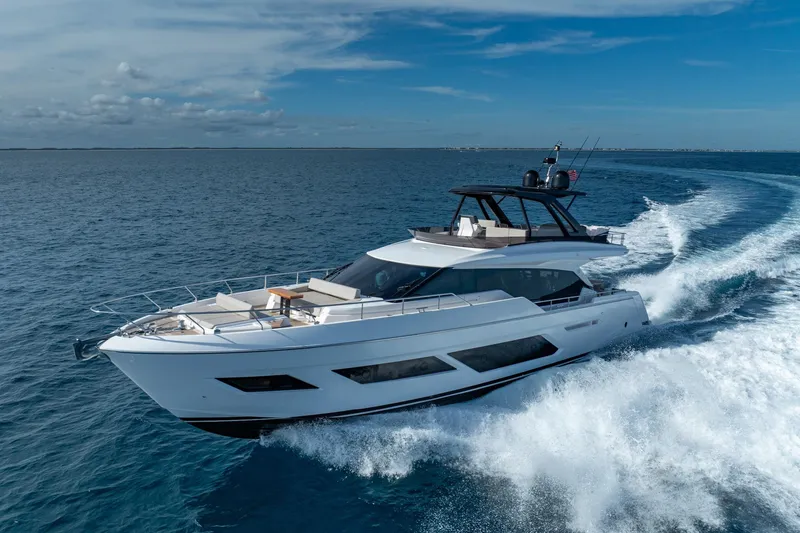 Slide: The Image of Luxurious 2023 Ferretti Yachts 720 cruising on open sea under clear blue sky. - 4