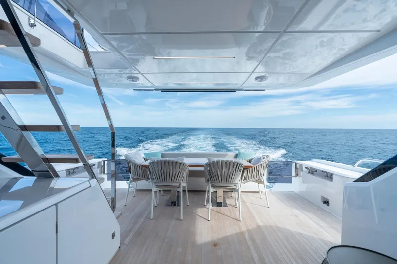 Slide: The Image of Luxury Ferretti Yachts 720, 2023 model, cruising on open sea with elegant deck seating. - 41