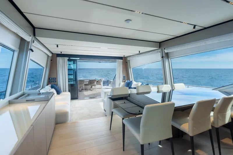 Slide: The Image of Luxurious interior of 2023 Ferretti Yachts 720 with ocean view and elegant dining area. - 44