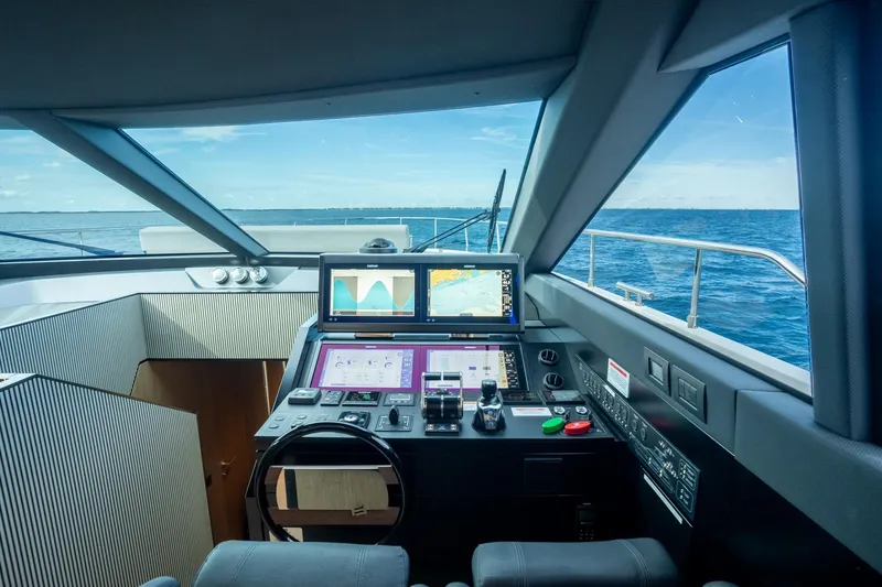 Slide: The Image of Cockpit of 2023 Ferretti Yachts 720 with advanced navigation systems and ocean view. - 46