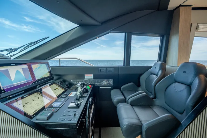 Slide: The Image of Luxurious helm of 2023 Ferretti Yachts 720 with advanced navigation systems and ocean view. - 47