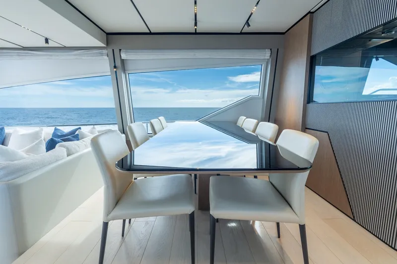 Slide: The Image of Luxurious interior of 2023 Ferretti Yachts 720 with ocean view and elegant dining area. - 50