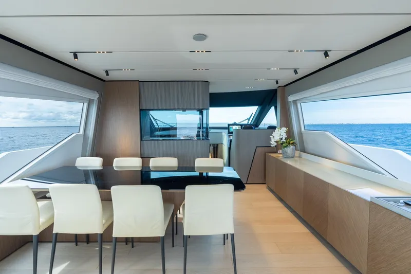 Slide: The Image of Luxurious interior of 2023 Ferretti Yachts 720 with elegant dining area and ocean view. - 51