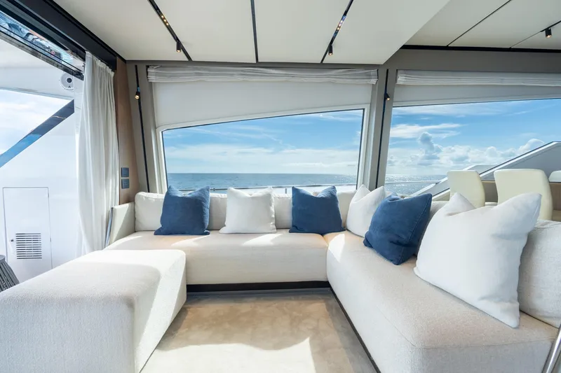 Slide: The Image of Luxurious interior of 2023 Ferretti Yachts 720 with ocean view and plush seating. - 53
