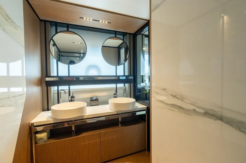 Slide: The Image of Luxurious bathroom in 2023 Ferretti Yachts 720, featuring dual sinks and modern design. - 59