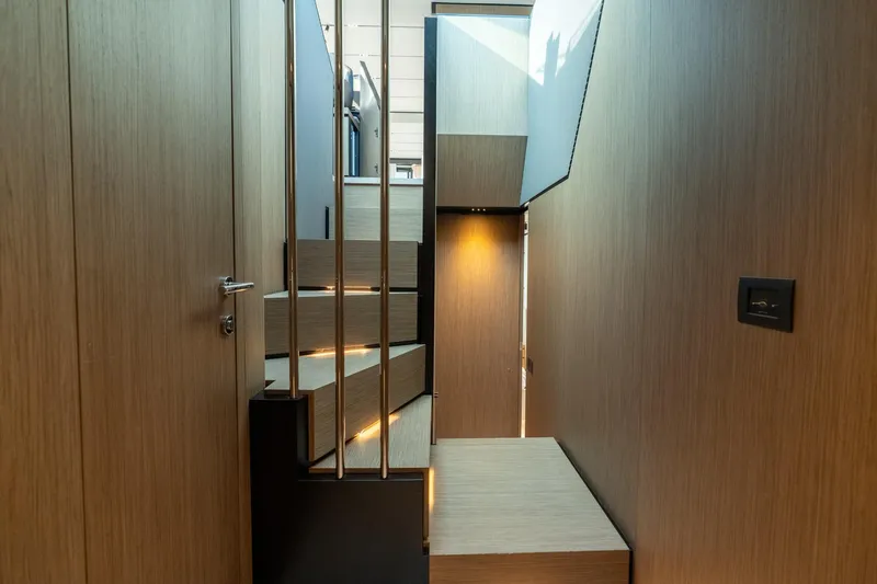 Slide: The Image of Modern interior staircase of 2023 Ferretti Yachts 720, featuring sleek wood paneling. - 65