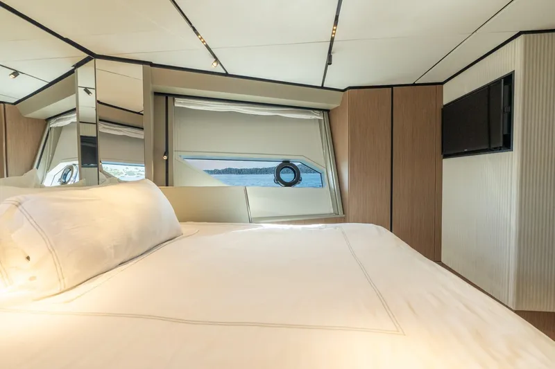 Slide: The Image of Luxurious bedroom interior of 2023 Ferretti Yachts 720 with elegant design and scenic window view. - 71