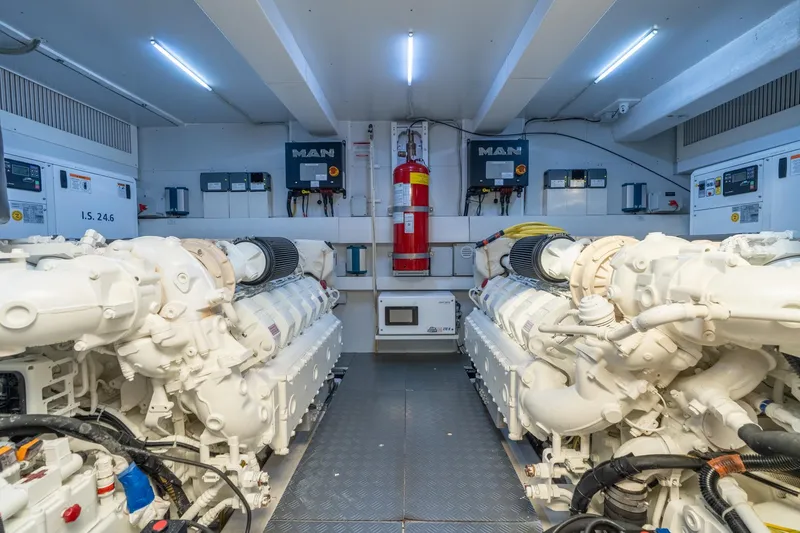 Slide: The Image of Engine room of 2023 Ferretti Yachts 720, featuring dual MAN engines and modern equipment. - 83