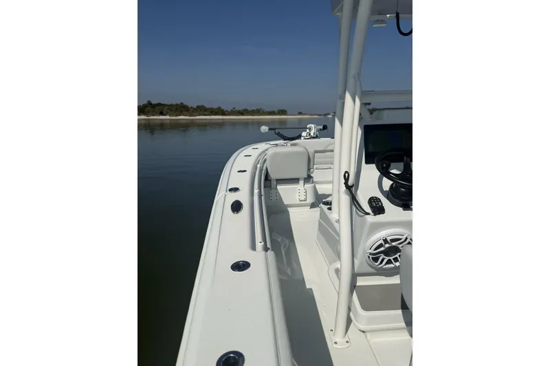 Slide: The Image of 2025 Yellowfin 26 Hybrid boat on calm water, showcasing sleek design and modern features. - 10