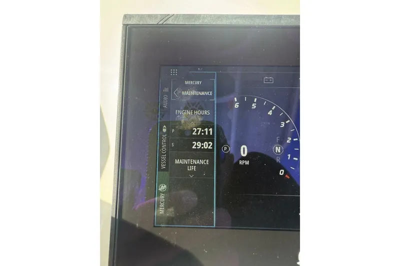Slide: The Image of Display screen of 2025 Yellowfin 26 Hybrid showing engine hours and maintenance data. - 12