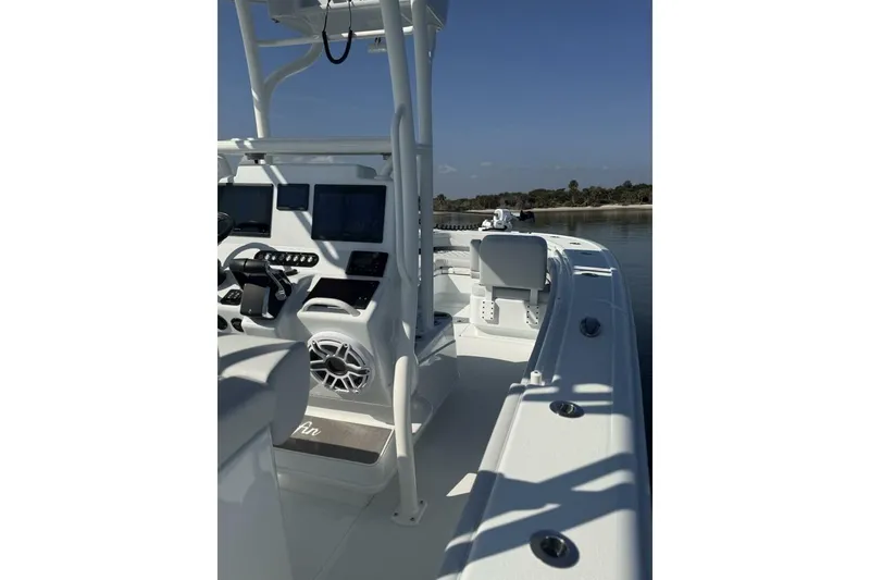 Slide: The Image of 2025 Yellowfin 26 Hybrid boat interior with advanced navigation systems and sleek design. - 16