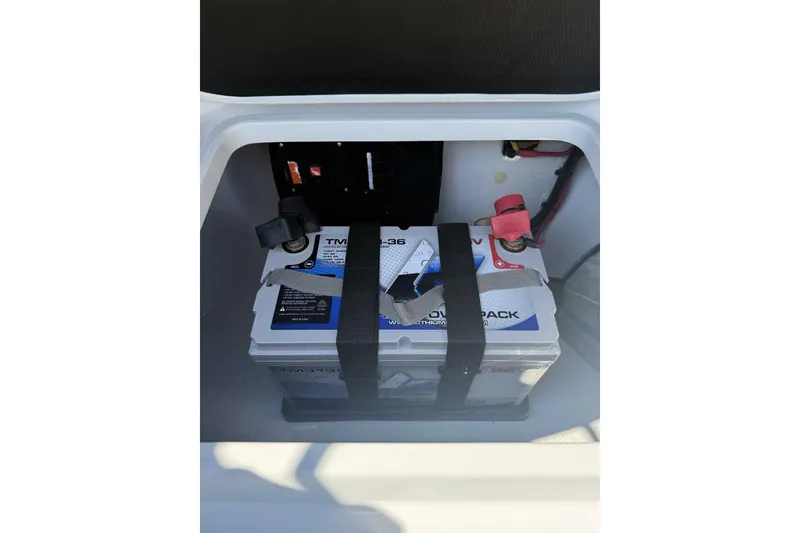 Slide: The Image of Battery compartment of 2025 Yellowfin 26 Hybrid boat, featuring secured power pack. - 25