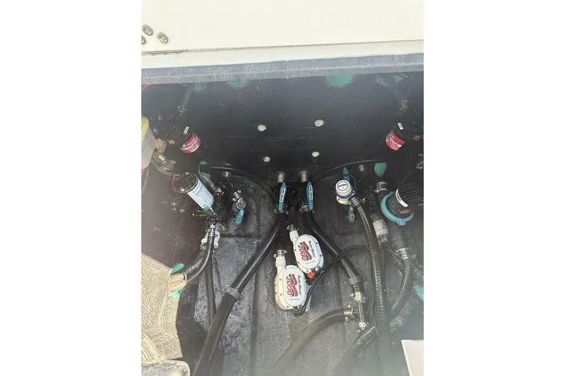 Slide: The Image of Bilge area of 2025 Yellowfin 26 Hybrid boat with pumps and hoses. - 26