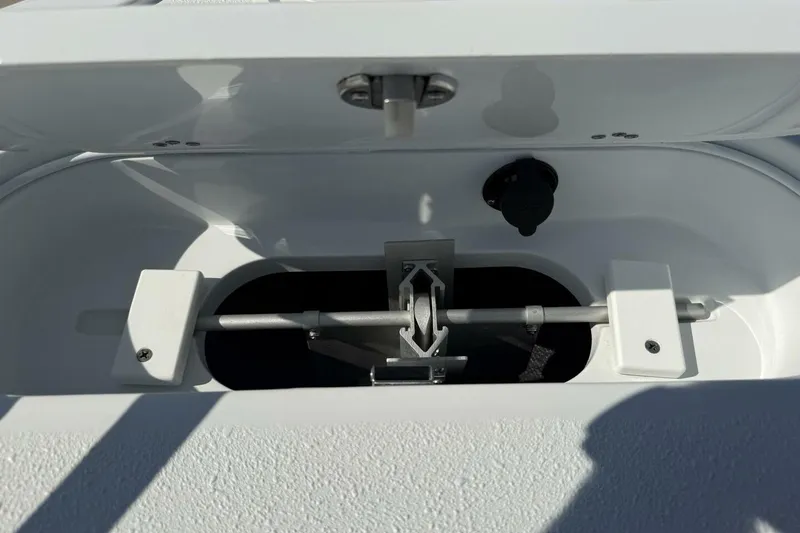 Slide: The Image of Open compartment of 2025 Yellowfin 26 Hybrid boat, showcasing interior mechanism. - 3