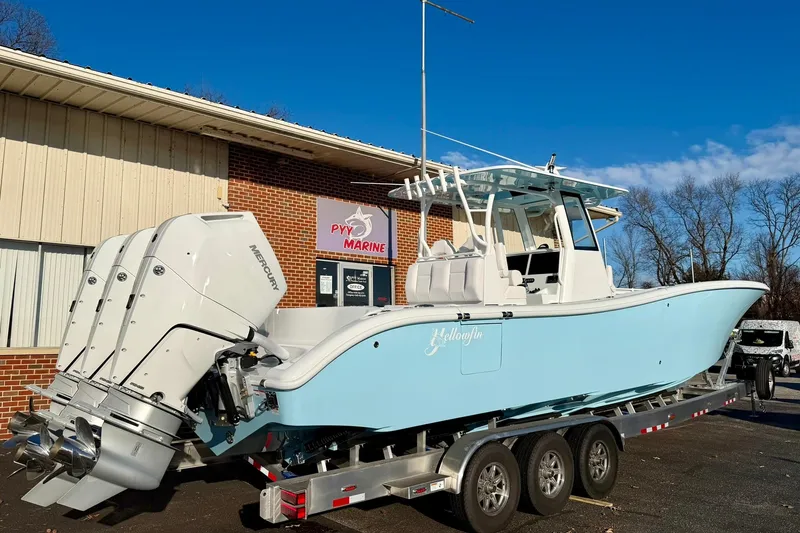 The Image of 2026 Yellowfin 36 Offshore boat on trailer, parked outside PYY Marine building. - 1