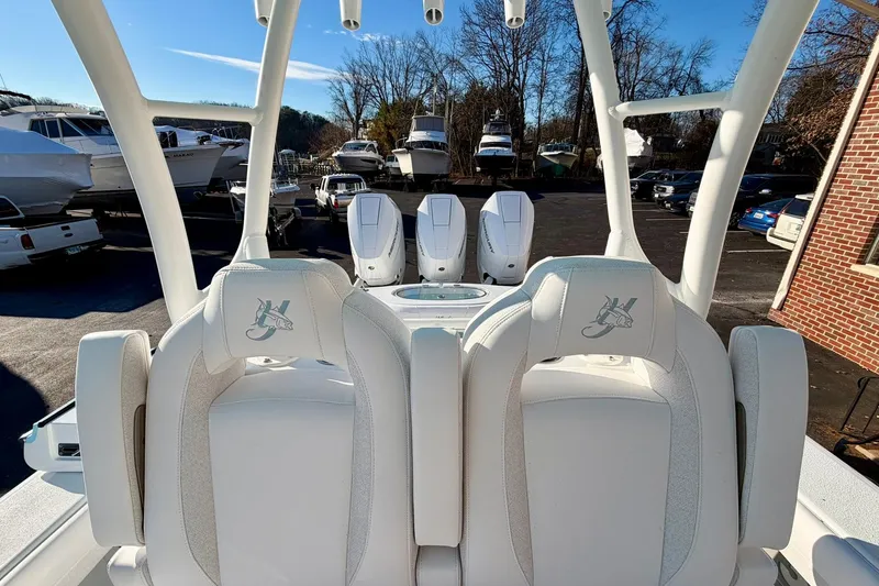 Slide: The Image of 2026 Yellowfin 36 Offshore boat with triple engines, parked outdoors. - 7