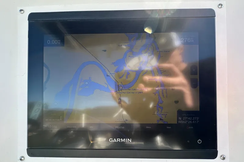 Slide: The Image of Garmin GPS display on 1999 Robalo 2420 Center Console boat showing navigation map. - 24