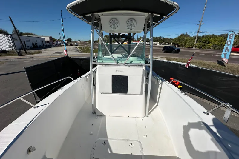 Slide: The Image of 1999 Robalo 2420 Center Console boat with spacious deck and sturdy railings. - 40