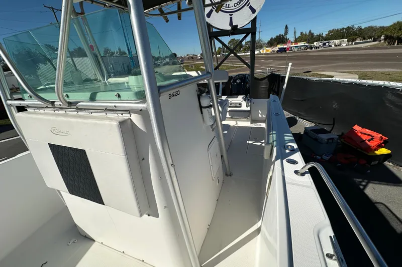 Slide: The Image of 1999 Robalo 2420 Center Console boat with spacious deck and modern design. - 44