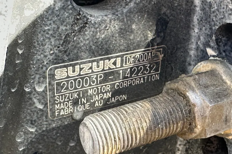 Slide: The Image of Close-up of Suzuki DF200AP engine label on 1999 Robalo 2420 Center Console boat. - 83