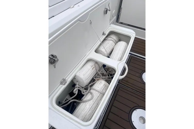 Slide: The Image of Storage compartment on 2015 Jeanneau Merry Fisher 855 Marlin with fenders and ropes. - 22