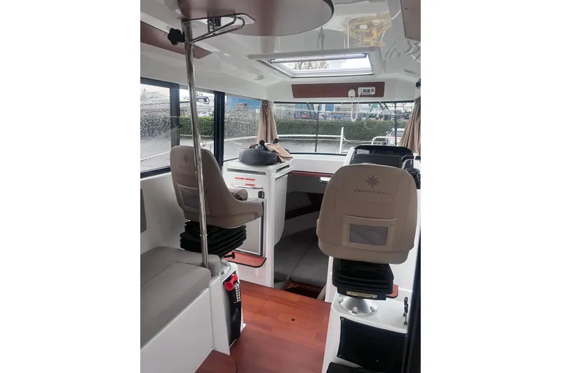 Slide: The Image of Interior of 2015 Jeanneau Merry Fisher 855 Marlin boat with seating and helm. - 9