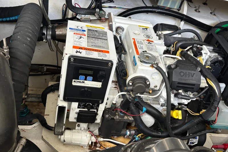 Slide: The Image of Engine compartment of a 2016 Sea Ray 350 Sundancer with Kohler generator. - 10