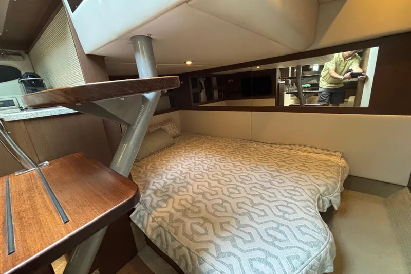 Slide: The Image of Interior cabin of 2016 Sea Ray 350 Sundancer with cozy bed and modern design. - 19