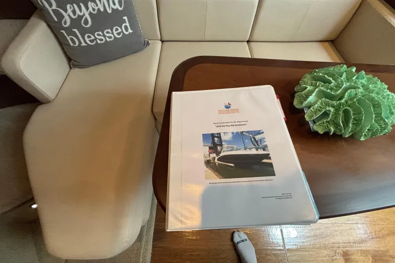 Slide: The Image of Binder on table in Sea Ray 350 Sundancer yacht interior, 2016 model. - 20