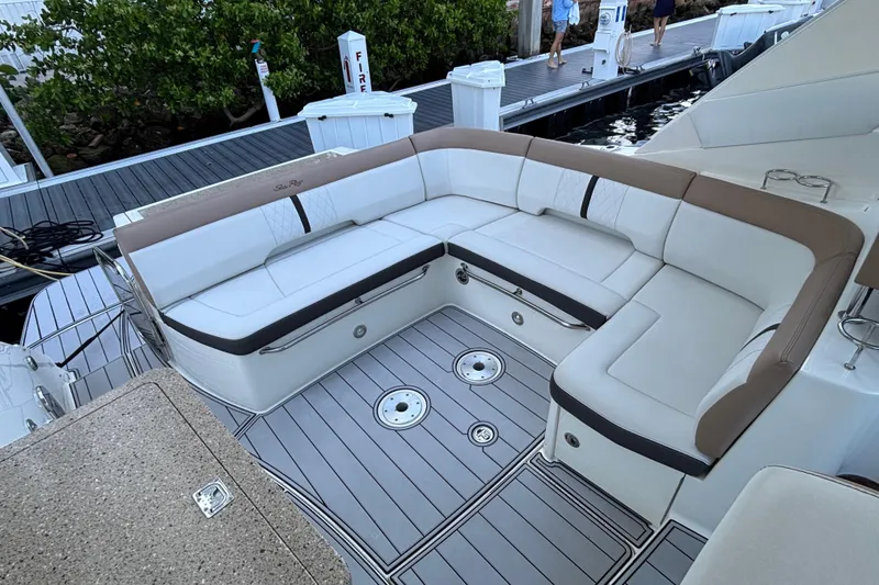 Slide: The Image of 2016 Sea Ray 350 Sundancer boat with spacious seating area and sleek design. - 26