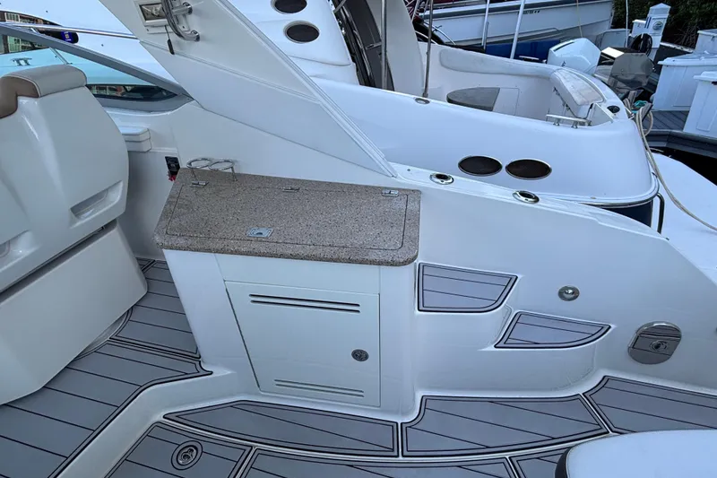 Slide: The Image of 2016 Sea Ray 350 Sundancer boat interior with sleek seating and modern design. - 27
