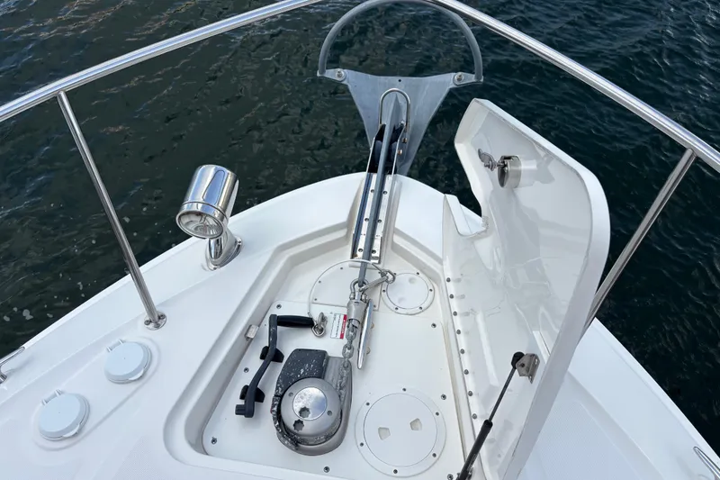 Slide: The Image of 2016 Sea Ray 350 Sundancer anchor system on deck, with water in the background. - 7