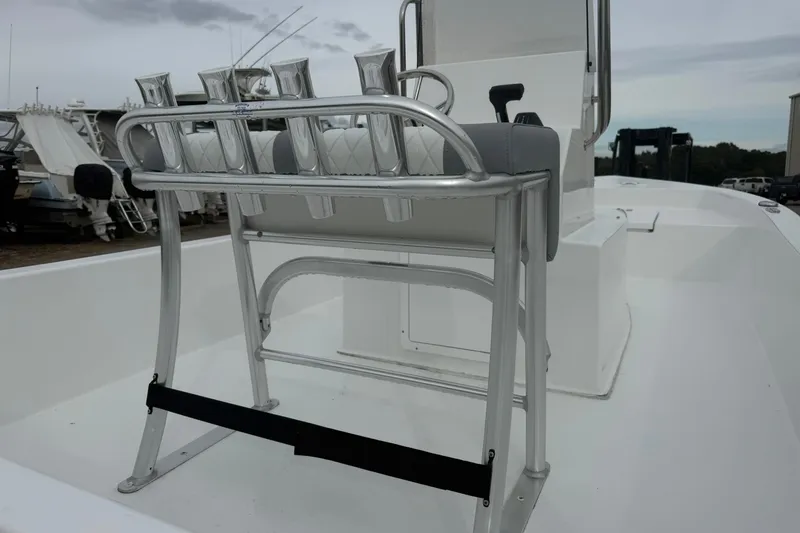 Slide: The Image of 2026 Lookout Bay 19 boat with rod holders and seating on deck. - 10