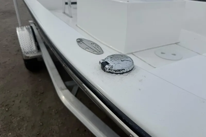 Slide: The Image of Close-up of a 2026 Lookout Bay 19 boat deck with metal fittings. - 15