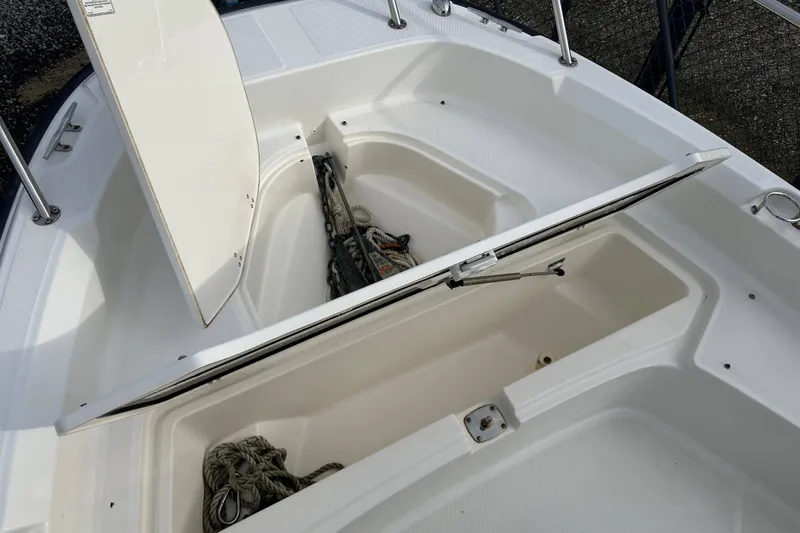 Slide: The Image of Manufacturer Provided Image: 2016 Boston Whaler 210 Dauntless boat with two people fishing on calm water. - 14