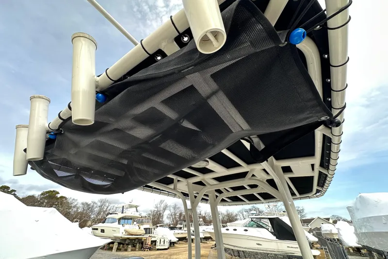 Slide: The Image of 2016 Boston Whaler 210 Dauntless boat with covered console, docked outdoors. - 22