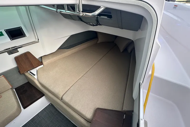 Slide: The Image of Interior cabin of 2022 Axopar 37 XC Cross Cabin with cozy seating and modern design. - 16