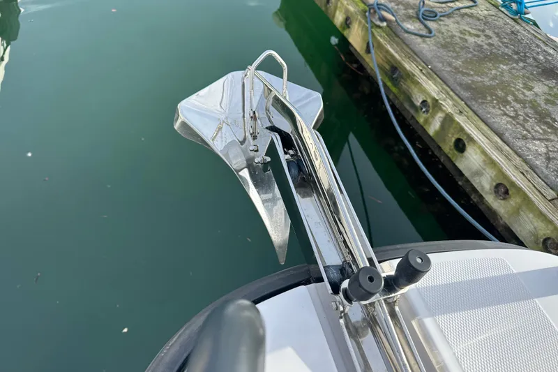 Slide: The Image of Anchor of 2022 Axopar 37 XC Cross Cabin near dock. - 21