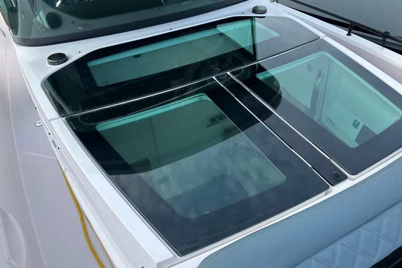 Slide: The Image of 2022 Axopar 37 XC Cross Cabin with sleek glass roof design. - 23