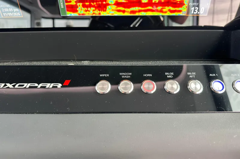 Slide: The Image of Control panel of 2022 Axopar 37 XC Cross Cabin with labeled buttons and display. - 4