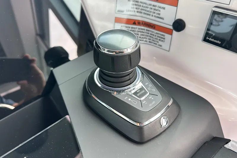 Slide: The Image of Joystick control panel on 2022 Axopar 37 XC Cross Cabin boat dashboard. - 6