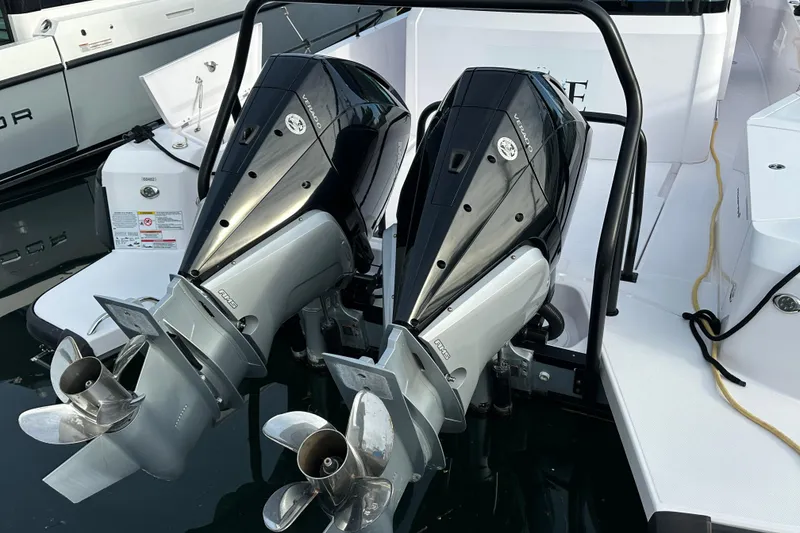 Slide: The Image of Twin outboard engines on a 2022 Axopar 37 XC Cross Cabin boat. - 9