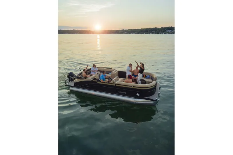 Slide: The Image of Captain's chair and helm of 2023 Harris Sunliner 230 Sport boat. - 11