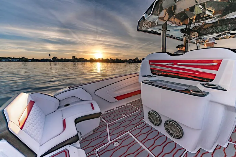 Slide: The Image of Manufacturer Provided Image: 2026 Sunsation 40 CCX boat interior with sunset view over calm water. - 12