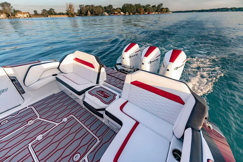 Slide: The Image of Manufacturer Provided Image: 2026 Sunsation 40 CCX boat interior with stylish seating and powerful outboard engines on a serene lake. - 13