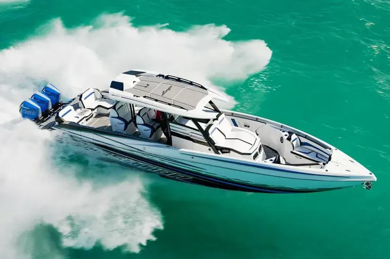 Slide: The Image of Manufacturer Provided Image: 2026 Sunsation 40 CCX speedboat cruising on turquoise water, showcasing sleek design and powerful engines. - 3
