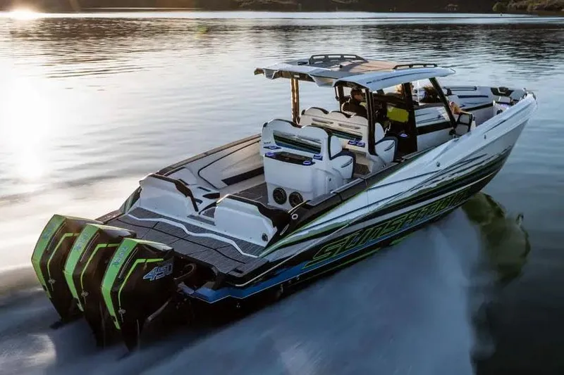 Slide: The Image of Manufacturer Provided Image: 2026 Sunsation 40 CCX speedboat cruising on calm water at sunset. - 5