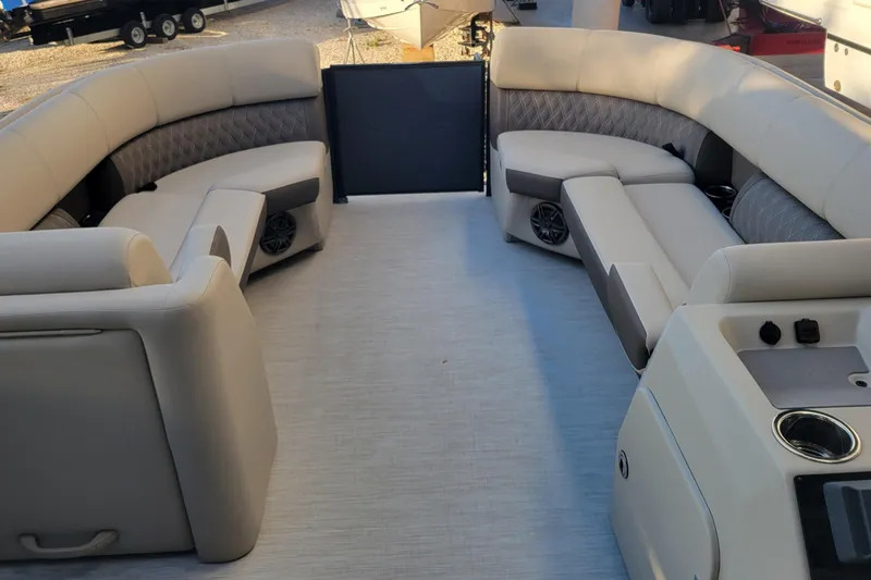 Slide: The Image of Luxurious interior of 2023 Harris Sunliner 250 Sport pontoon boat with plush seating. - 14