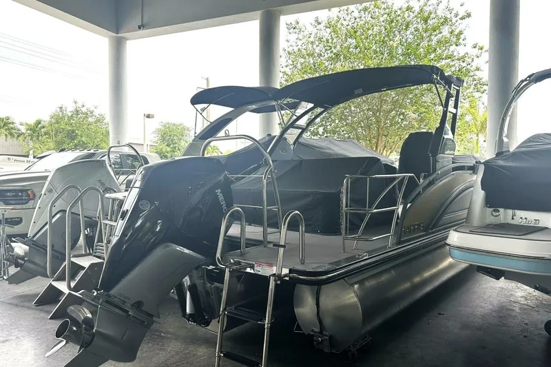 Slide: The Image of 2023 Harris Sunliner 250 Sport pontoon boat with sleek design and modern features. - 3