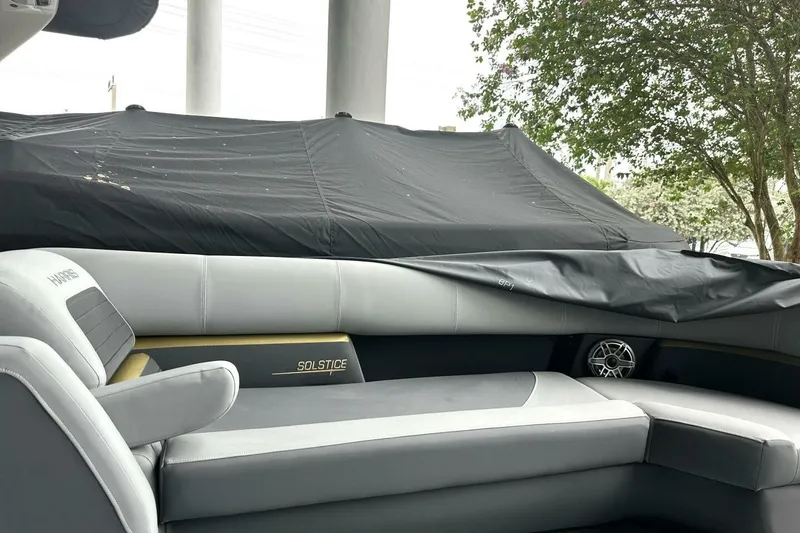 Slide: The Image of 2023 Harris Sunliner 250 Sport boat interior with plush seating and modern design. - 9